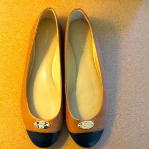 Coach flats. 7B. Caramel and black leather.